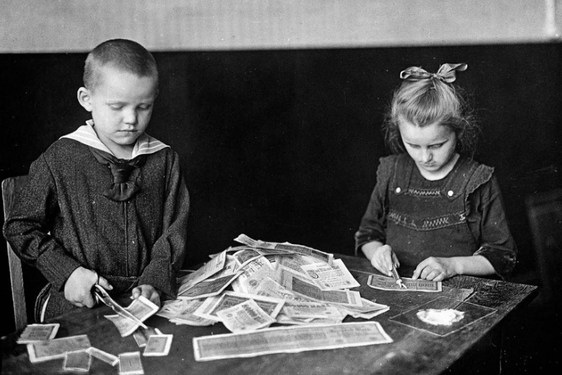 Children playing with stacks of hyperinflated currency during the Weimar Republic, 1922 _ Old US Nostalgia