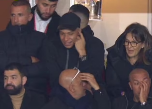 Kylian Mbappe watches PSG from stands following half time substitution