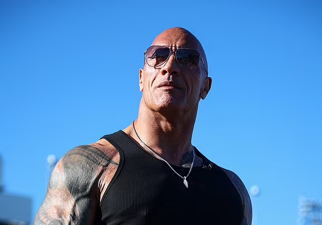 Dwayne Johnson, 51, says he regrets 'not reconciling' with his professional wrestler father Rocky 'Soulman' Johnson before he died in 2020 at 75: 'He raised me with tough fatherly love'