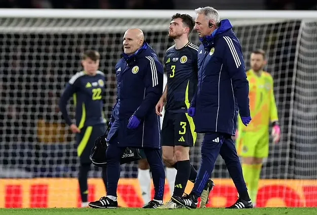 Liverpool hopeful Andy Robertson has not suffered a serious injury as they await scan results on his ankle after the defender limped off in Scotland friendly defeat