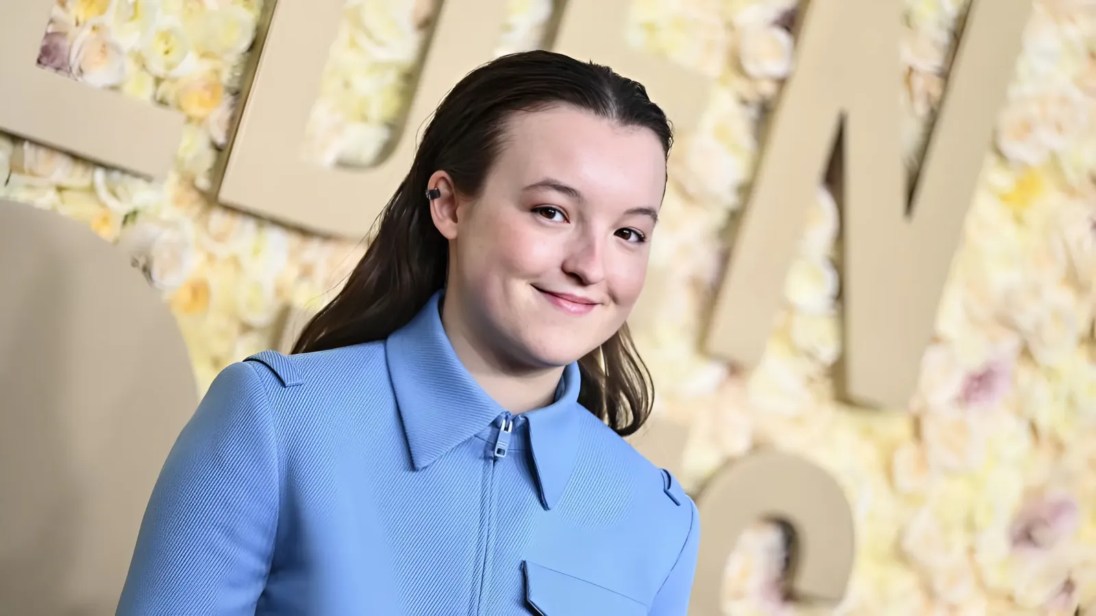 Bella Ramsey Wears a Blue and Gray Prada Suit at the Golden Globes