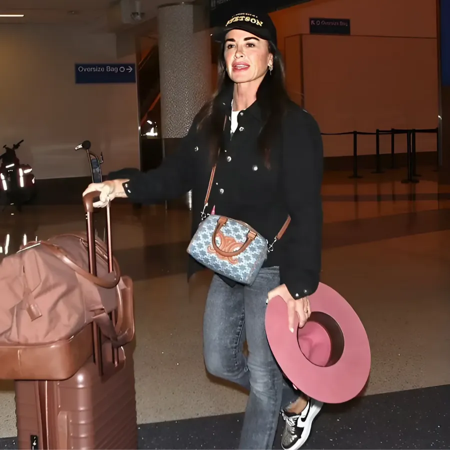 Kyle Richards arrives back in LA after supporting gal pal Morgan Wade in Minnesota - as ex Mauricio Umansky moves on with Russian-born actress