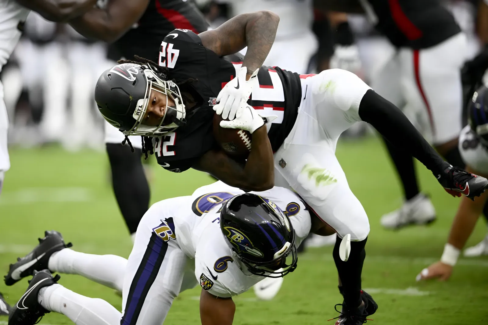 Backup quarterback Josh Johnson completed all 11 of his passes, helping the Baltimore Ravens narrowly defeat the Atlanta Falcons 13-12