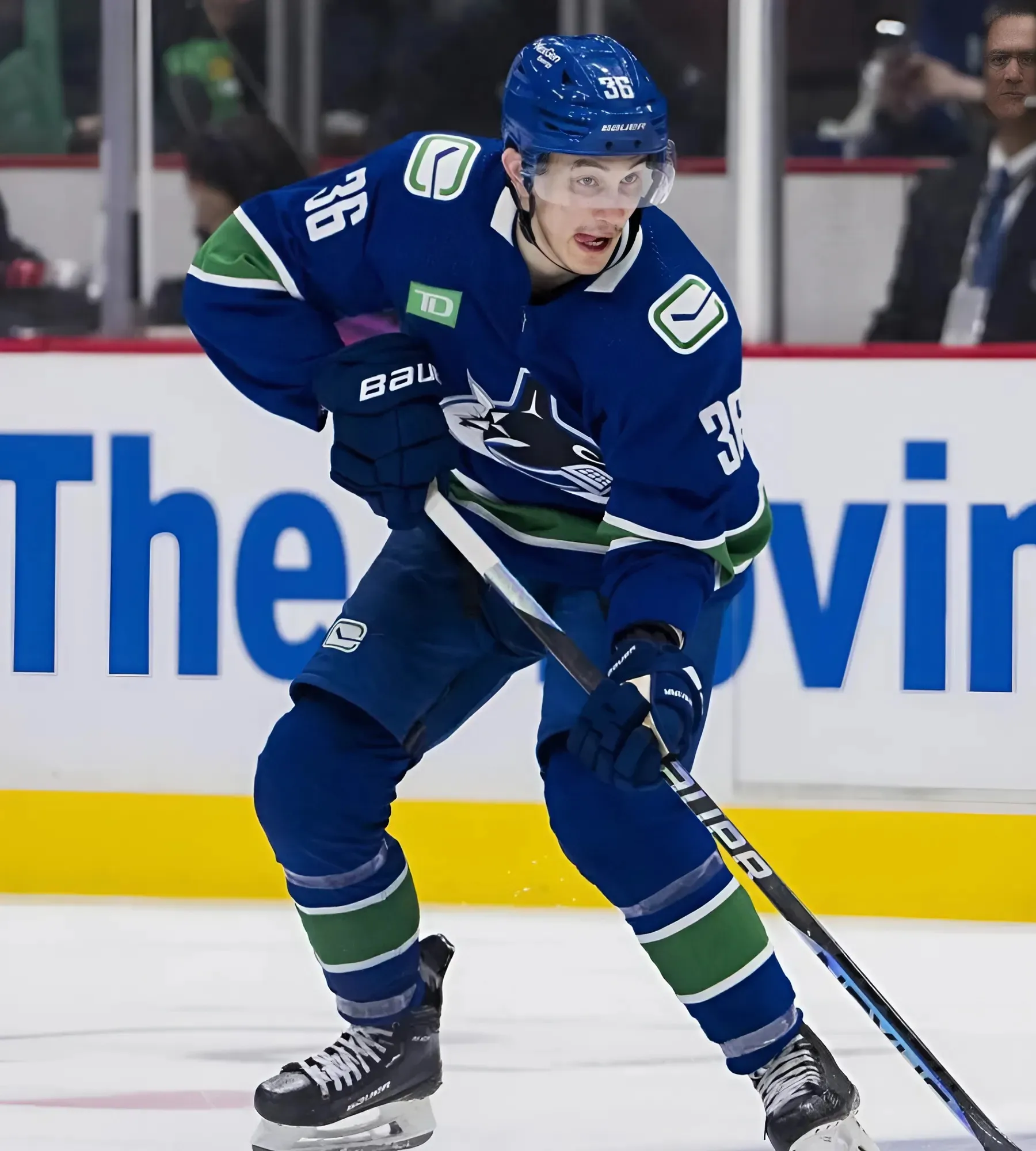 Canucks’ Akito Hirose exits vs. Flames after awkward fall into boards