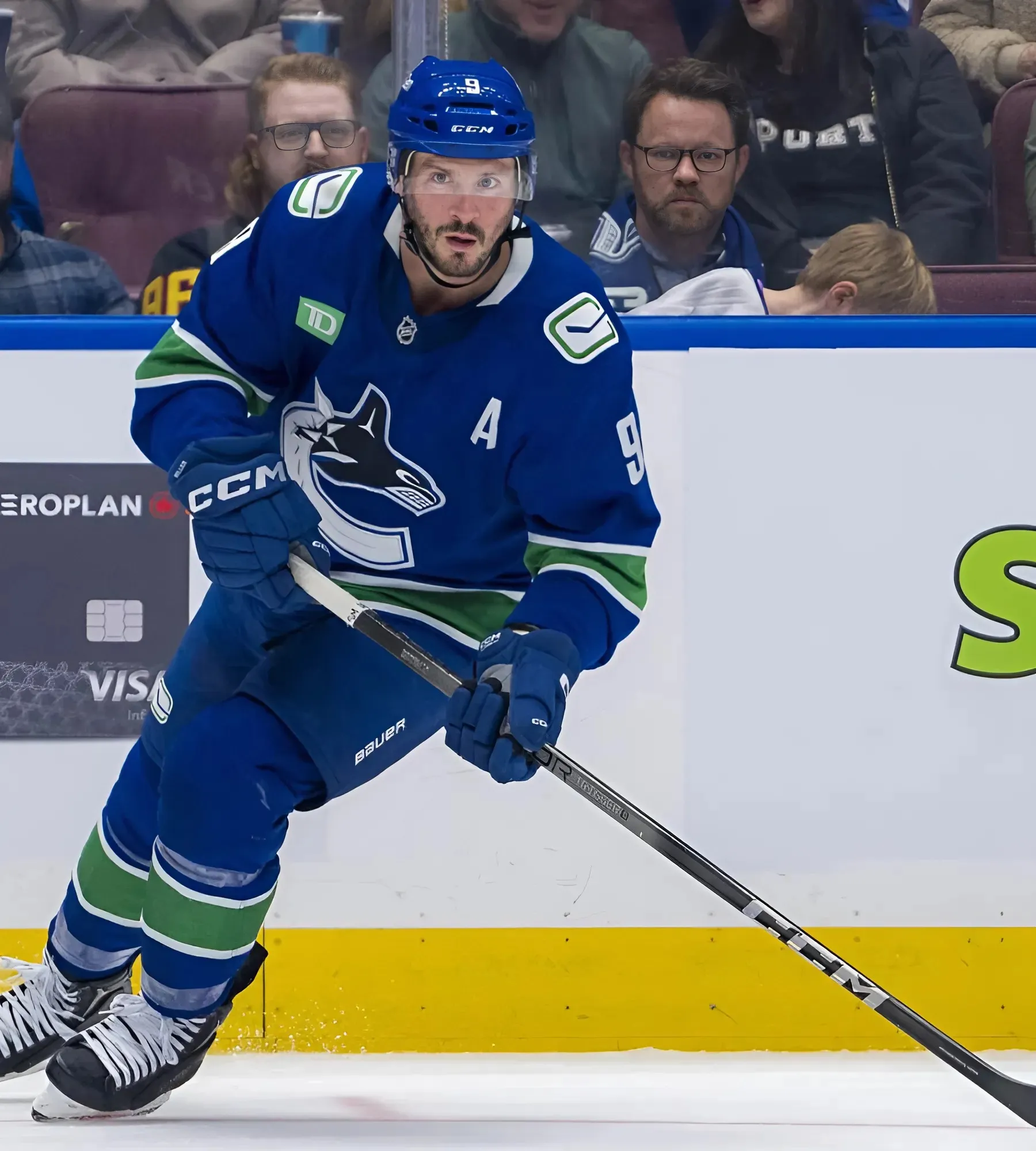 Canucks’ Miller fights Flames’ Mantha after hit injures Kevin Rooney