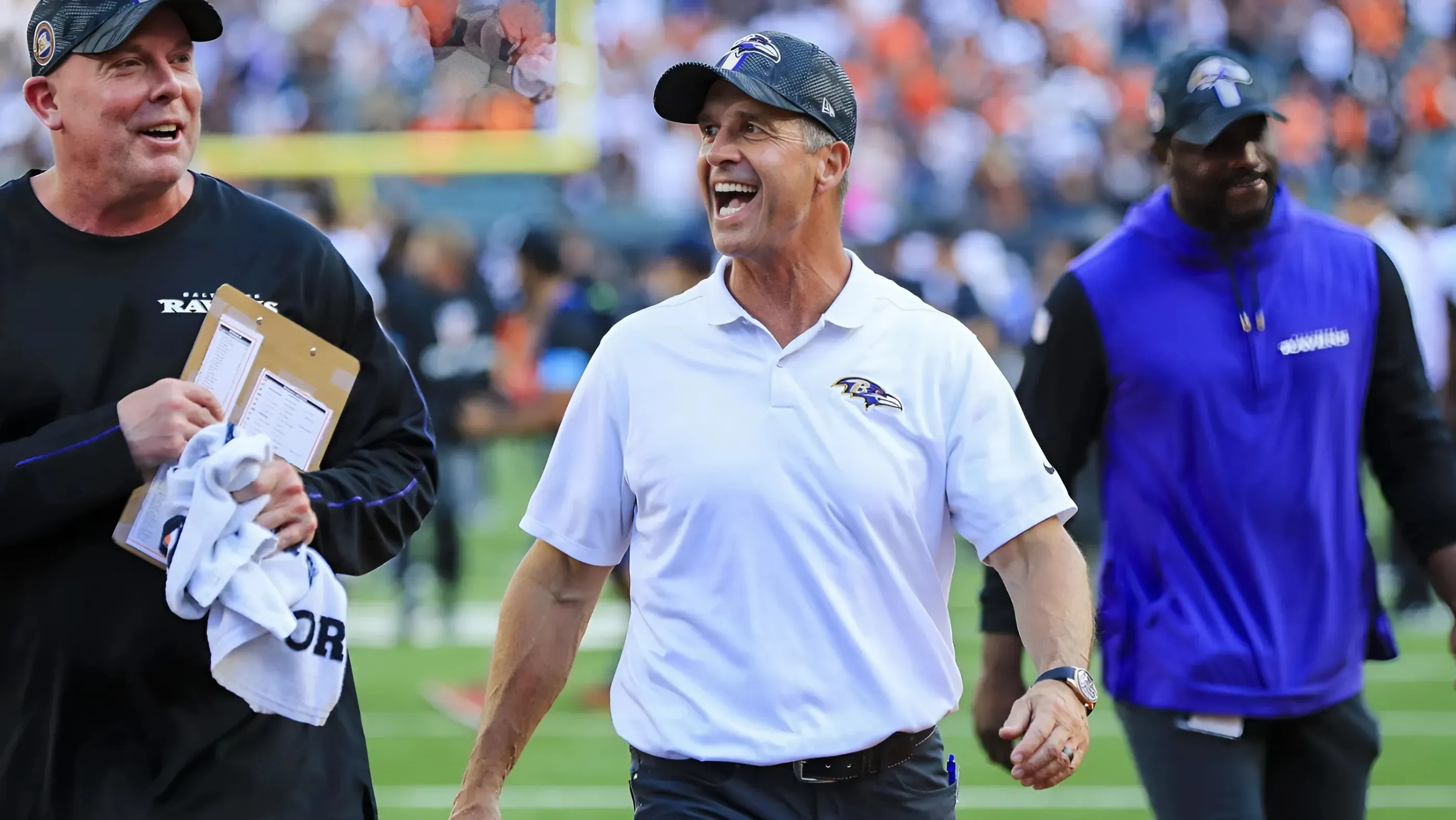 John Harbaugh rushes out of press conference early due to Jim Harbaugh illness