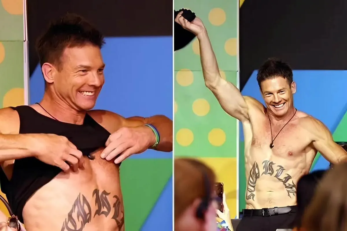 AFL legend Ben Cousins reveals his ripped abs and famous stomach tattoo during shock act at Perth Telethon tram