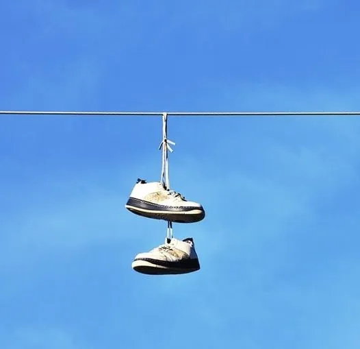 The Meaning Behind Sneakers Hanging from Power Lines