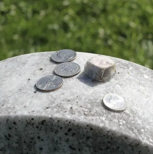 If you find a coin on a loved one’s gravestone, you had better know what it means