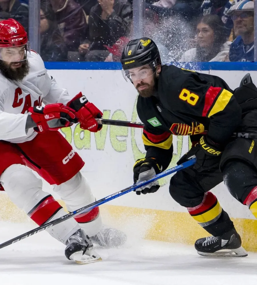 Canucks’ Conor Garland and Dakota Joshua hilariously work Tim Hortons Drive Thru