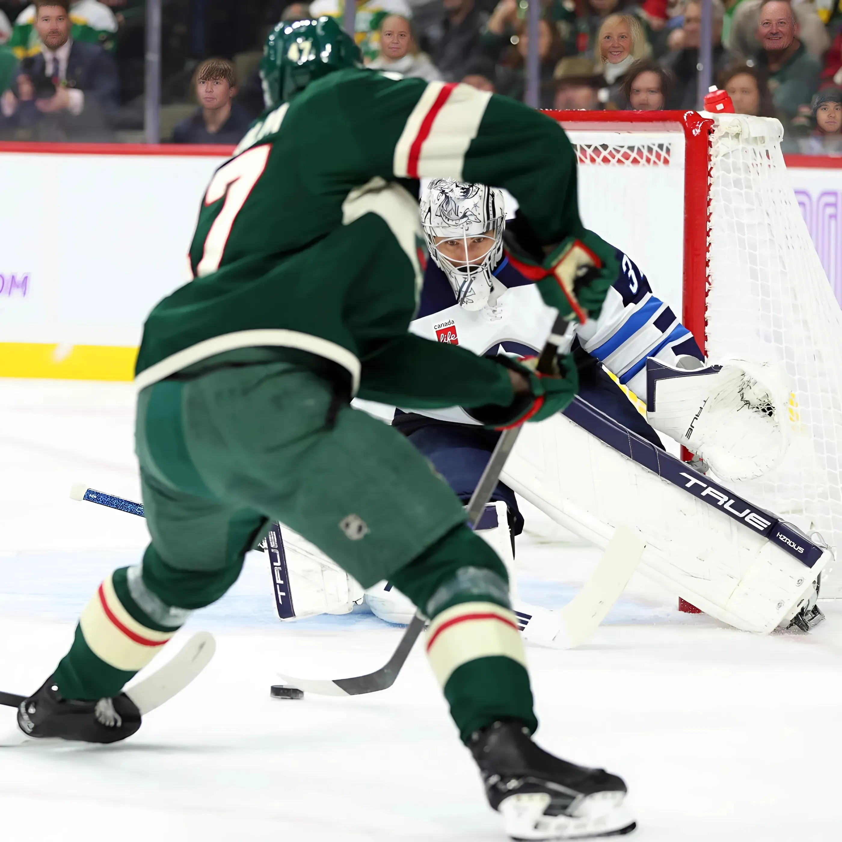 Wild labor to loss against first-place Jets despite Kaprizov's return