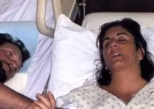 F. Husband watches as wife’s pulled from life support but then she turns and says “get me out of here”