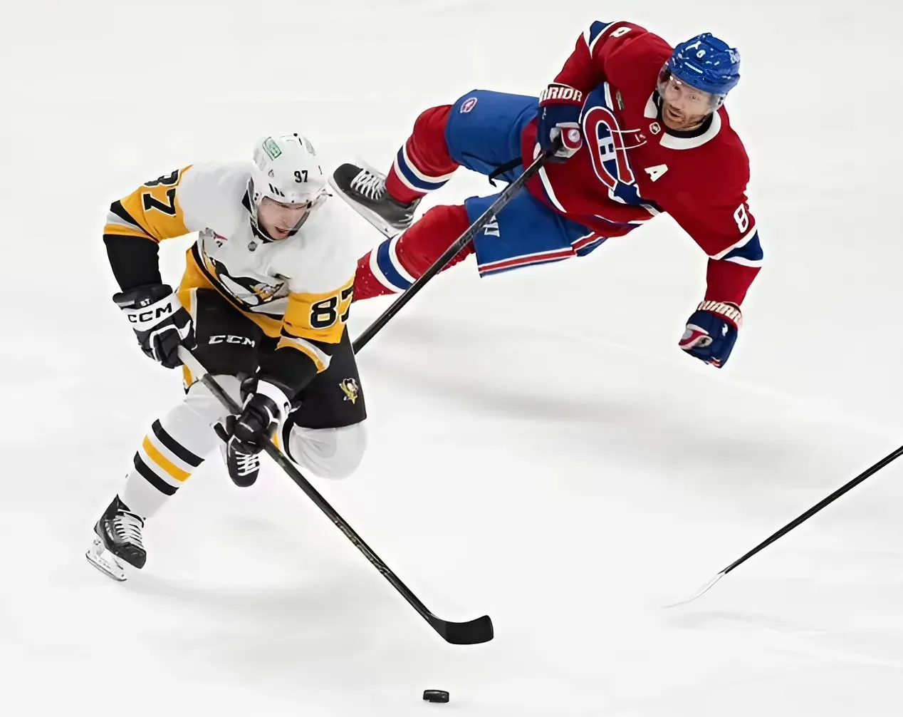 Bryan Rust has hat trick as Penguins score 6 in 3rd period and rout Canadiens 9-2