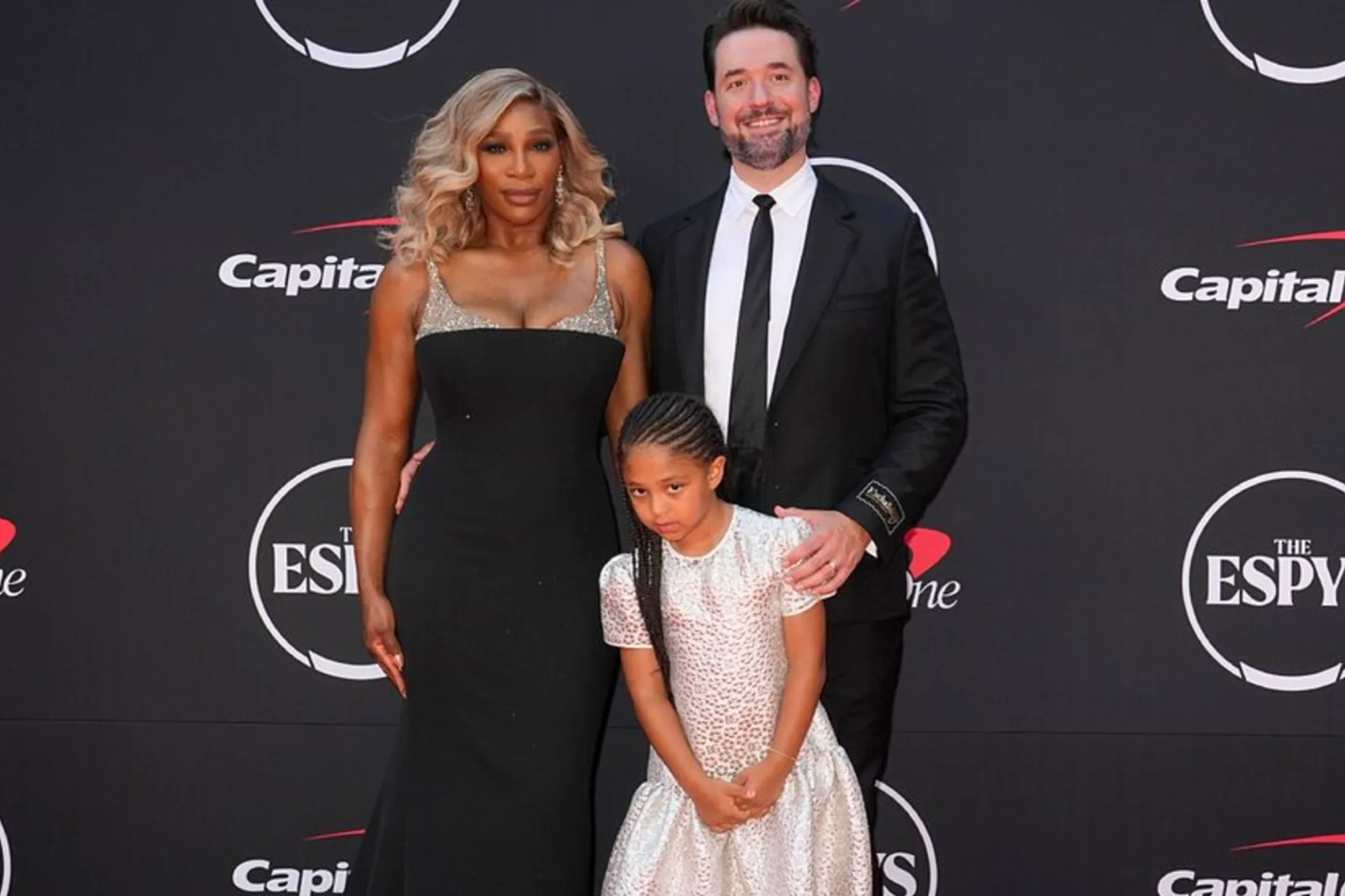 Serena Williams looks spectacular in a white evening dress and offers some important advice to her fans