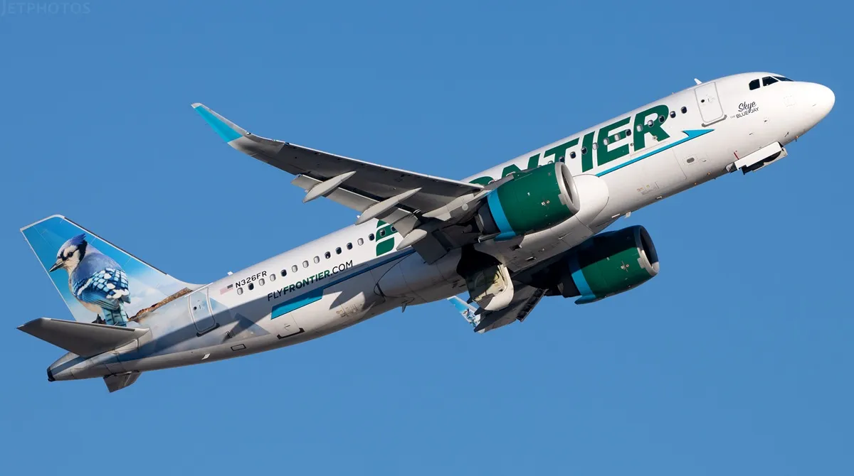 Chaotic moment screaming Frontier Airlines passenger is tied up in his seat for punching window