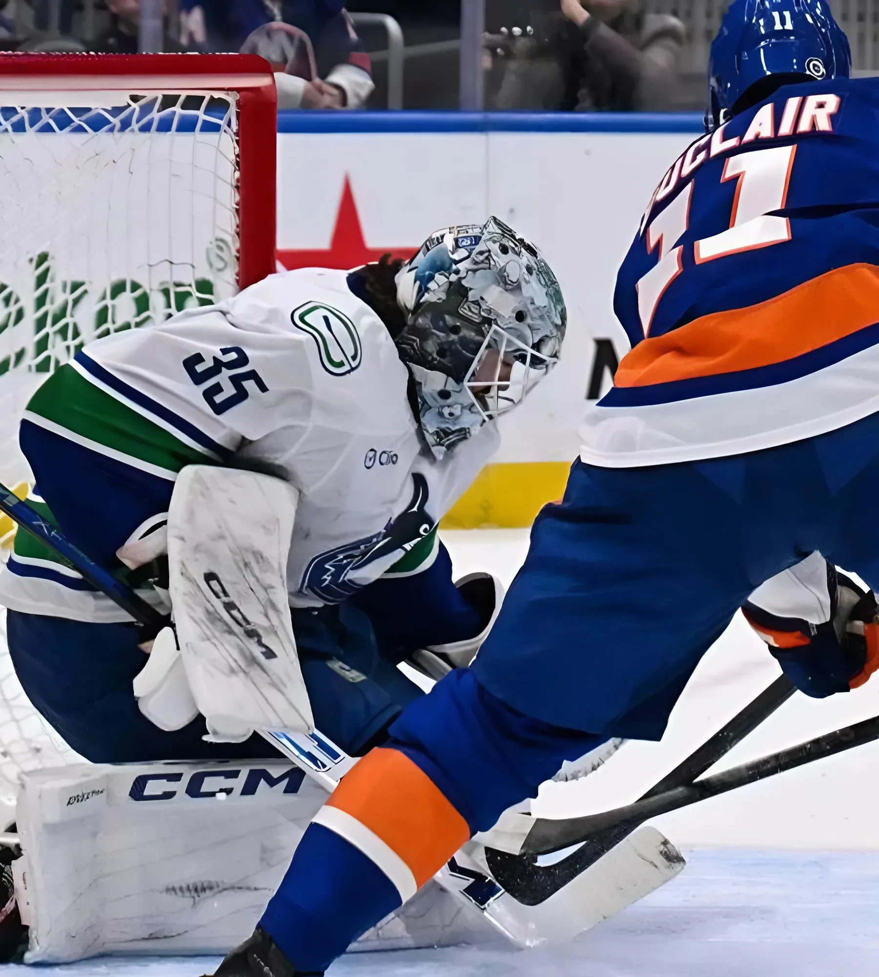 Quick three-goal surge lifts Canucks past Islanders