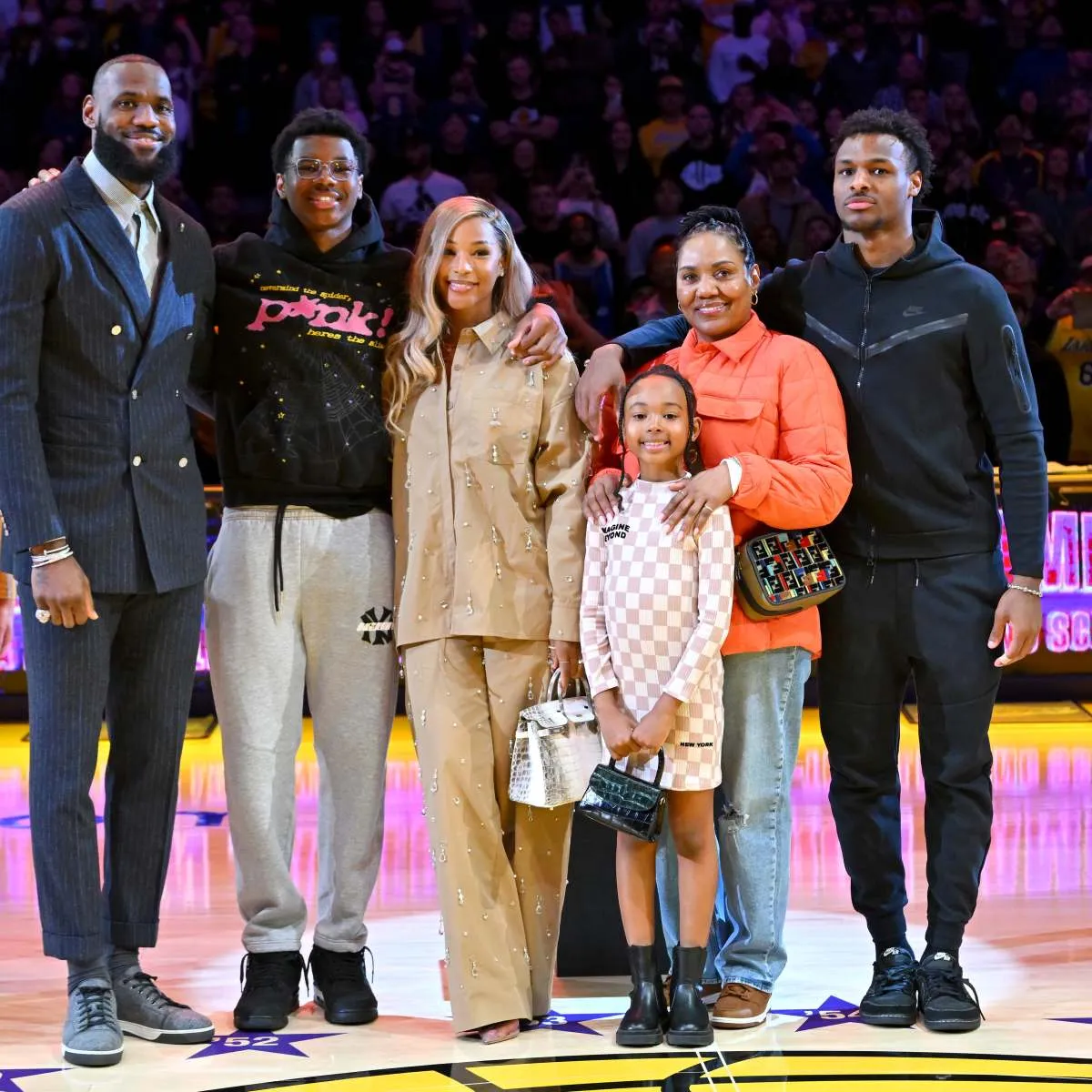 LeBron James thanks his mom for gifting him a mini basketball hoop at the age of 3, says his wife Savannah 'is the real MVP' and reveals he wanted 'to inspire' as LA Lakers honor him for making history