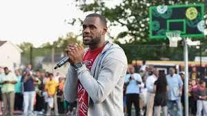 LeBron James speaks at a 2014 event unveiling two outdoor basketball courts he helped renovate at Patterson Park in Akron, Ohio