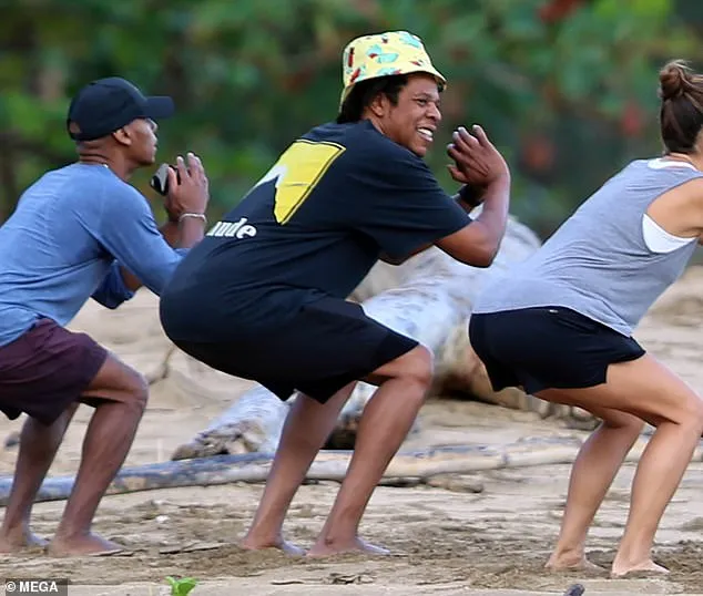 Jay-Z, 50, works hard and plays hard... as he takes a fitness class on the beach while enjoying a vacation in Hawaii🏋️