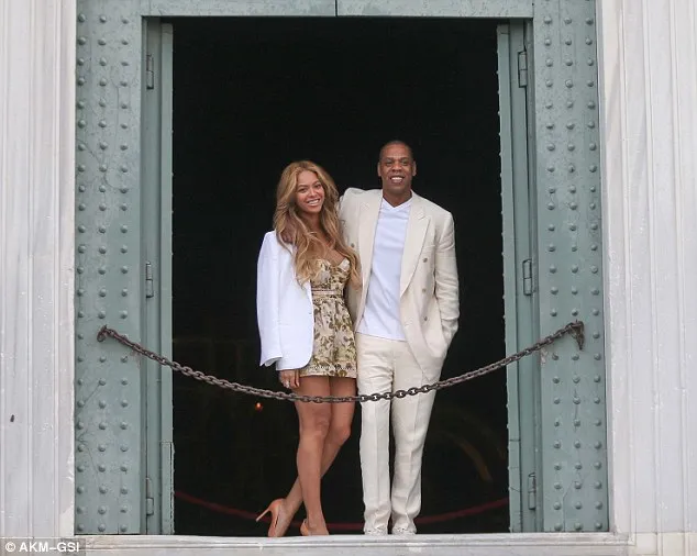 Beyonce bent down to take a picture of her husband Jay Z while enjoying a romantic sightseeing trip in Florence