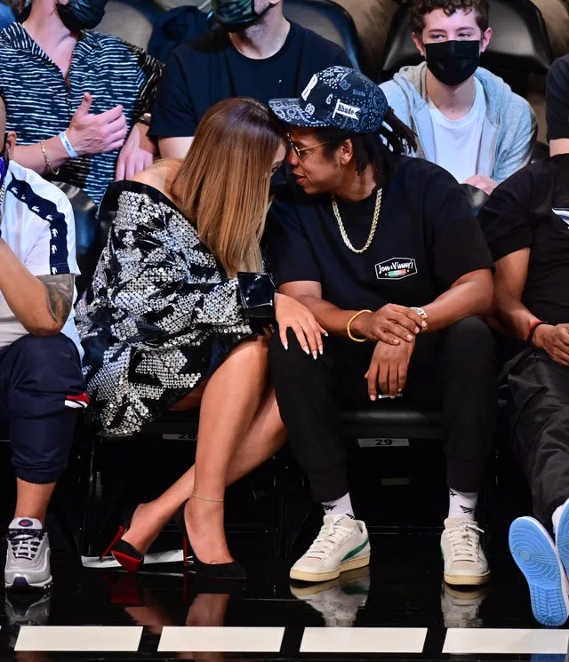 Beyoncé shyly nestles in JAY-Z’s lap and lovely moments during a romantic date night at the Brooklyn Nets Game