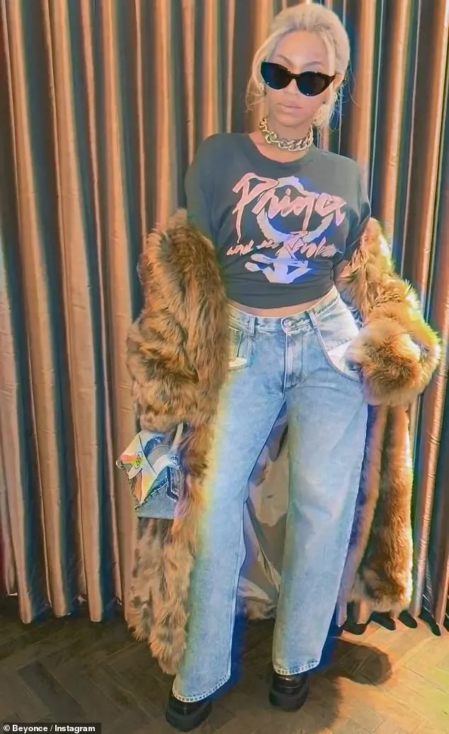 Beyonce wears Prince T-shirt in honor of his birthday... 20 YEARS after their legendary duet of Purple Rain at the Grammy Awards