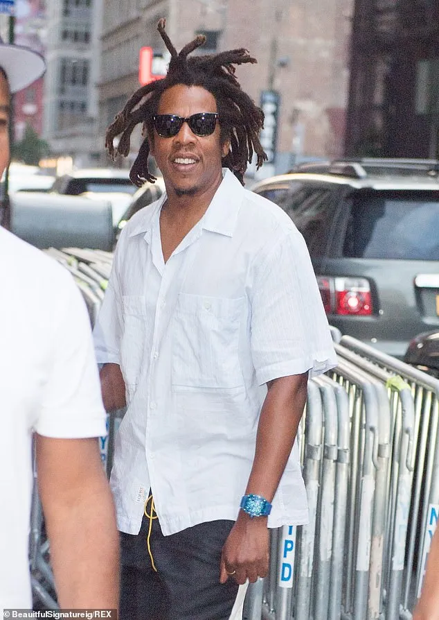 Jay-Z steps out solo while heading to his 40/40 Club in New York City... following his Tiffany campaign with Beyonce