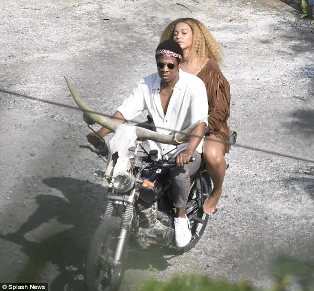 Beyonce looked stunning while filming in Kingston, wearing a fringed jacket and shorts as she rode on the back of husband Jay Z's motorbike