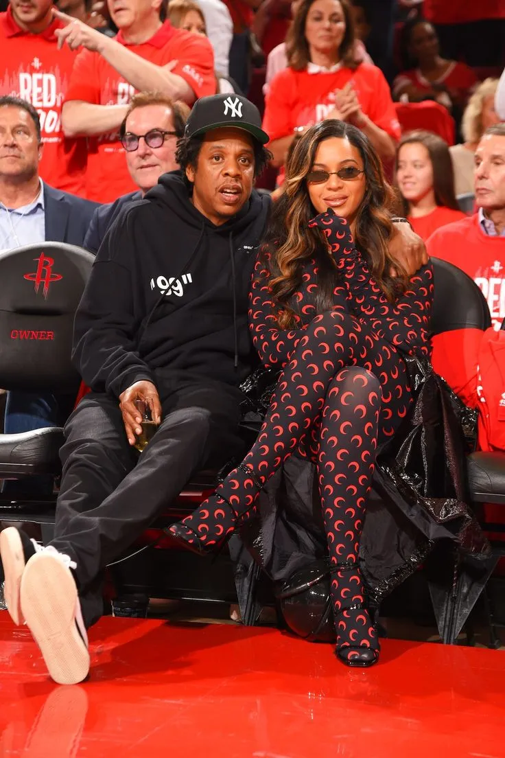 Beyonce wore a black moon-printed leggings set while accompanying husband Jay-Z to the Rockets-Warriors game to cheer on Houston