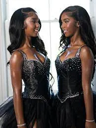 Sean 'Diddy' Combs' two teenage daughters attended prom over the weekend wearing identical dresses, sparkly heels, diamond earrings and even matching makeup.