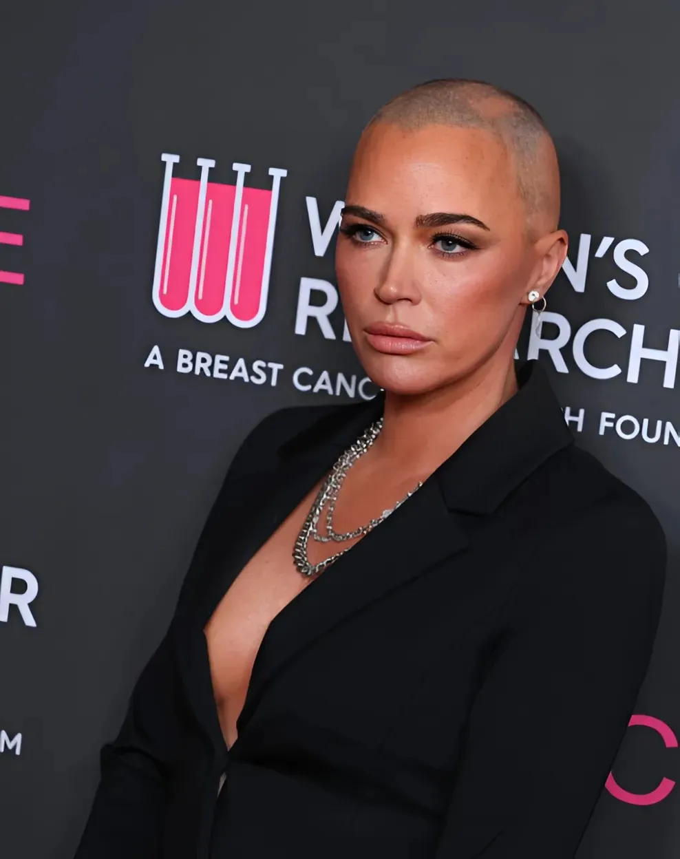 Embracing her journey, Mellencamp debuted a new tattoo over her surgery scar, featuring lyrics from her father John Mellencamp's song "Longest Days": TRANGHO