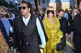 Beyonce and Jay Z lead a VERY star-studded guest list as Pharrell Williams debuts his first collection as Louis Vuitton's new creative director in a glitzy Paris runway show
