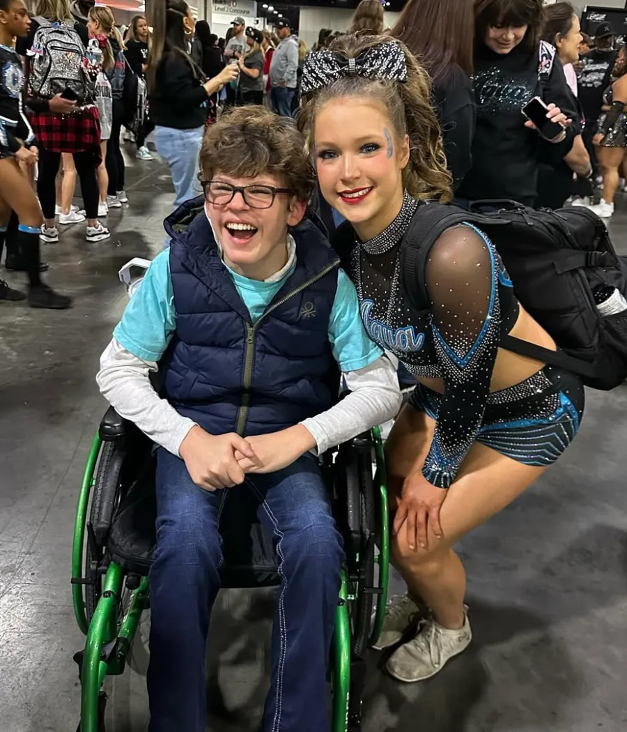 Cheer Spirit and Unstoppable Smiles: Gavin McHugh Shares Joyful Moment at Cheer Competition