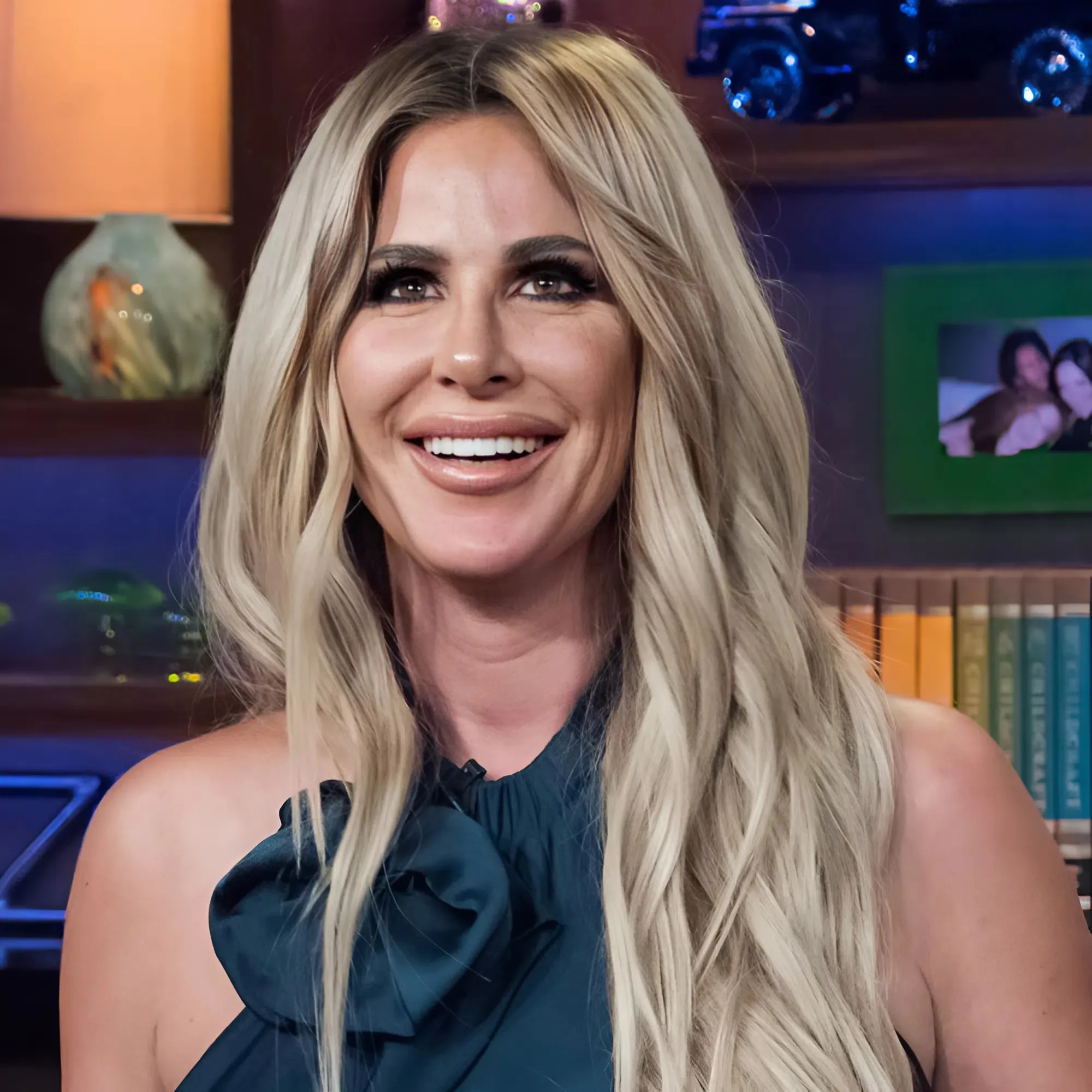 DOUBLE SCANDAL: Just got caught by the IRS for $1.8 million in unpaid debt, Kim Zolciak is now accused of 'abusing family trust' - her biological father demands the $100K be returned immediately or go to court!