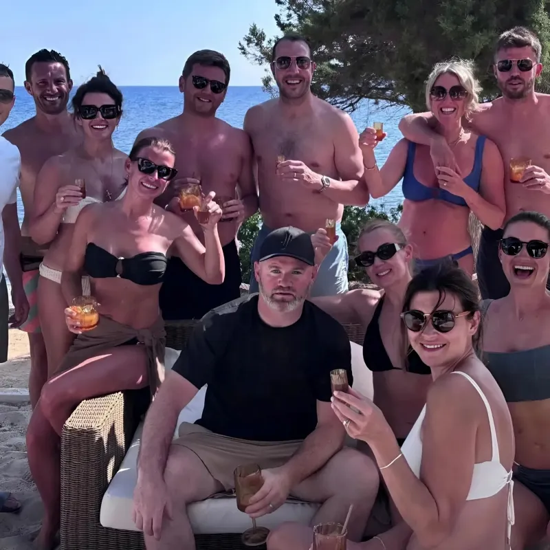Wayne Rooney pictured looking glum on holiday with Coleen & Utd legend pals... ngocc