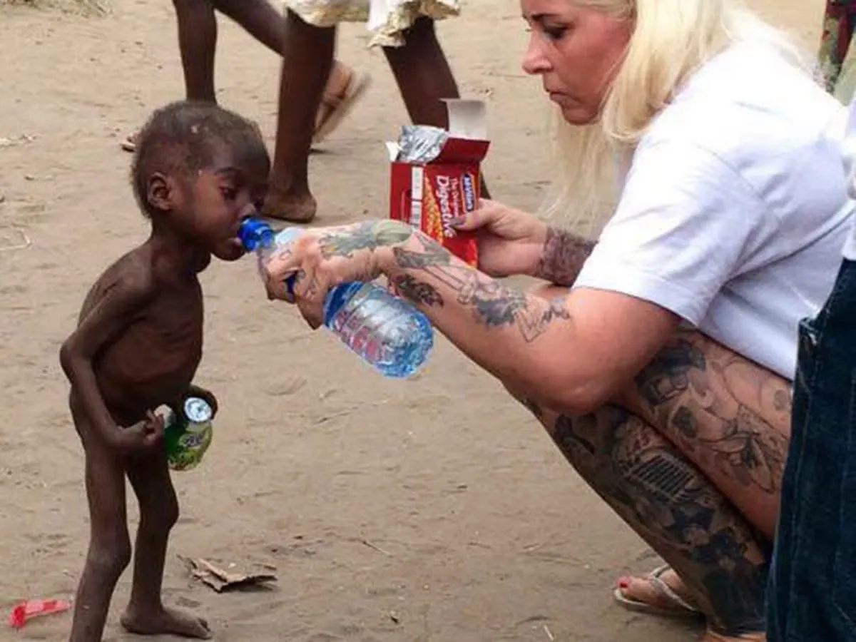 Aid worker who rescued dying child shares story behind this powerful image