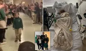Heartwarming moment six-year-old boy battling leukemia gets standing ovation from his classmates on his return to school after he was declared cancer free