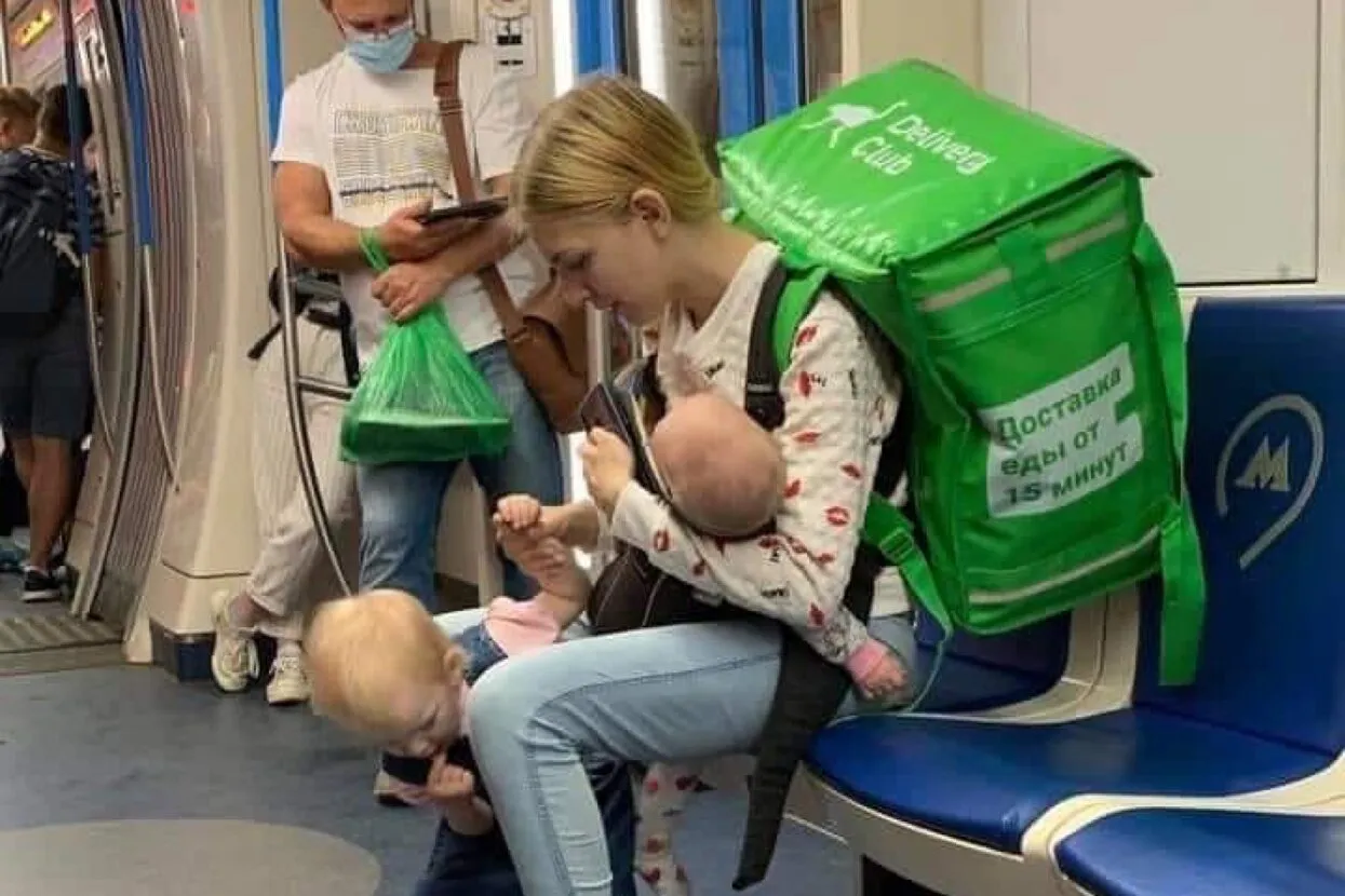 Photos of a young mother working as a courier in Moscow spark renewed calls for help — and fraud allegations