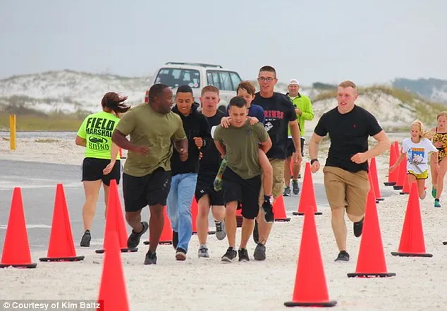 Heartwarming moment Marine carries cancer survivor, 11, across triathlon finish line after boy's prosthetic leg breaks Heartwarming moment Marine carries cancer survivor, 11, across triathlon finish line after boy's prosthetic leg breaks