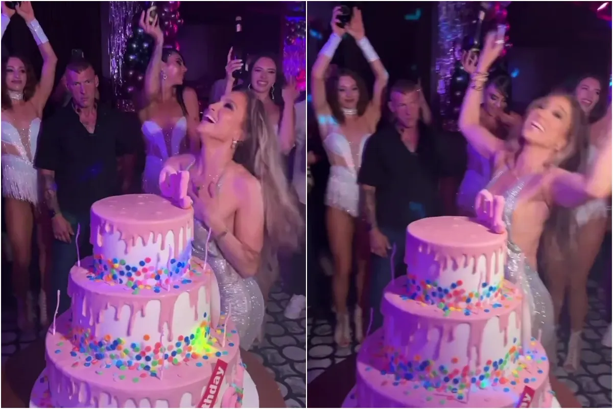 J-Lo goes braless as she stuns in plunging silver dress and dances around huge cake to celebrate 56th ngocc