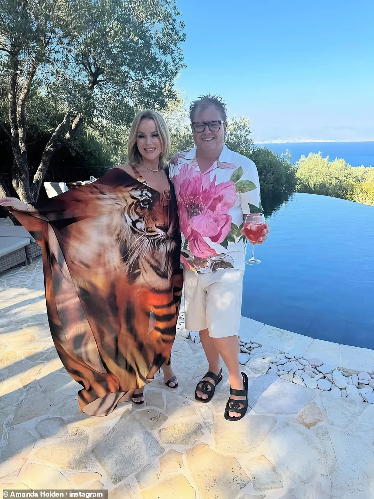 Amanda Holden, 54, Stuns Fans as She Flashes Bare Bottom in Wind-Blown Kaftan on Sexy Greek Getaway!