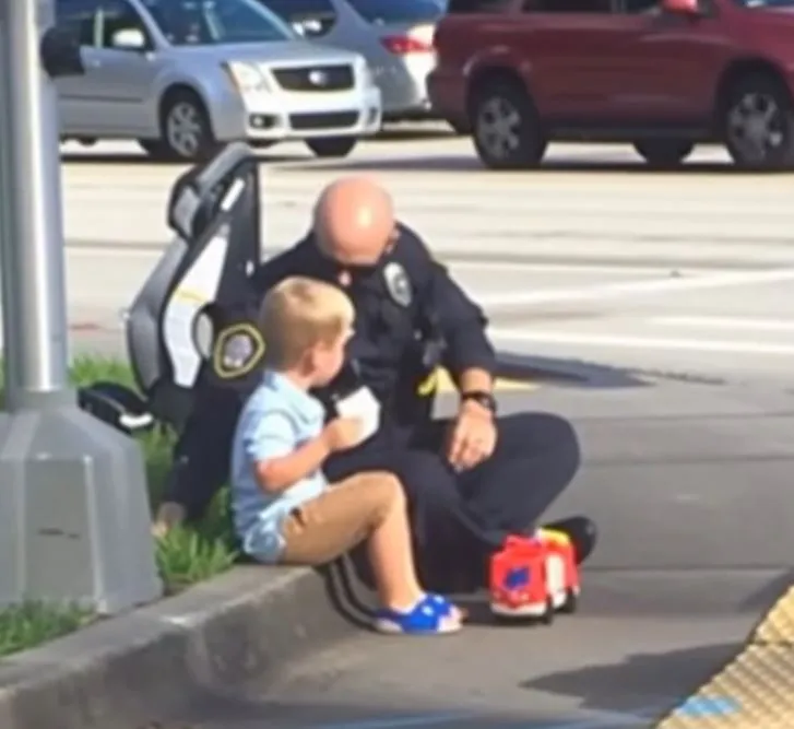 A police officer was sitting next to a young boy and told him few things that moved us to tears