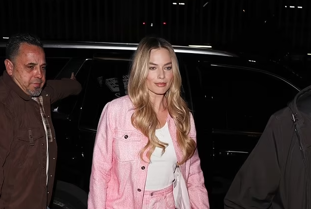 Margot Robbie channels casual cool Barbie in pastel pink look as she attends the film's screening at the Writers Guild in Beverly Hills