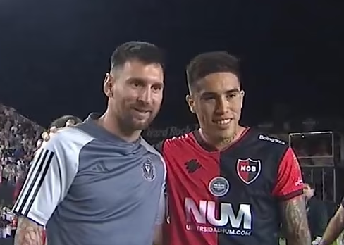 Lionel Messi is SWARMED for photos after playing former club Newell's Old Boys as eight players line up to get their picture taken with the Inter Miami superstar following pre-season clash