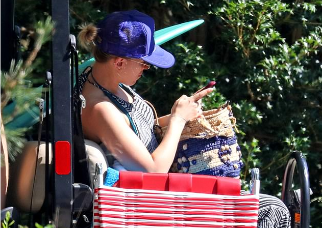 Scarlett Johansson flaunts her beach body and back tattoos