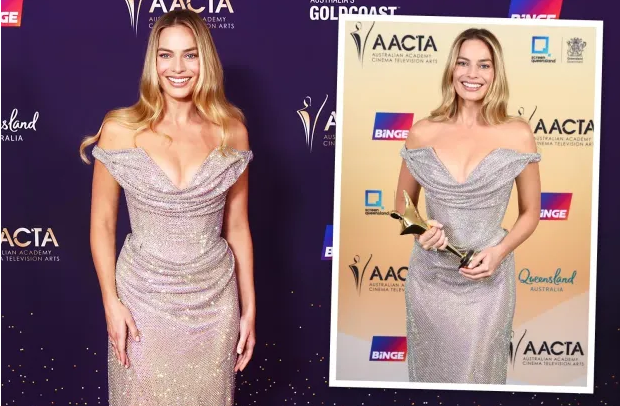 Barbie star Margot Robbie stuns in plunging gown on red carpet at awards bash in Australia