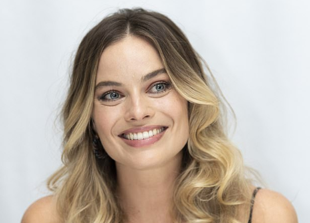 Margot Robbie looks radiant at a photo call in Los Angeles