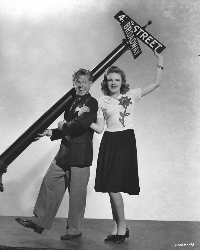 30 delightful photographs showcasing Mickey Rooney and Judy Garland during the filming of 'Babes on Broadway' in 1941.